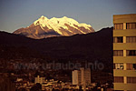 The Illimani enthrones over the metropolis La Paz in the sunset light