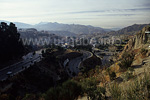 View to the lower city districts of La Paz, the swimming stadion is visible at the upper left