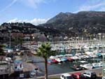 The old harbour of Menton with the boardwalk (Baie de Garavan) at the background