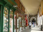 Under the archways there are a lot of shops