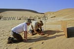 Chris, the guide, is digging in the Namib